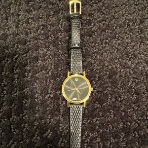 Movado black and gold watch